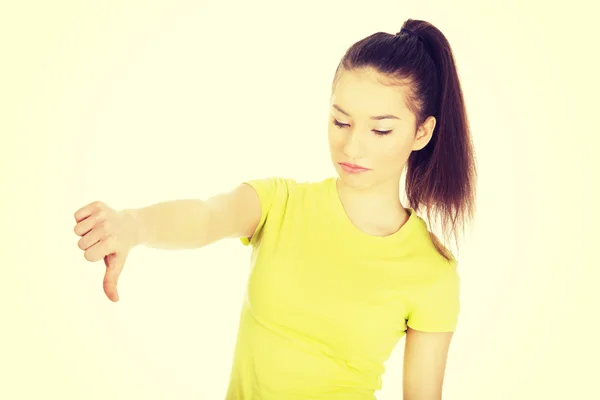 Ongelukkig vrouw met duim omlaag. — Stockfoto