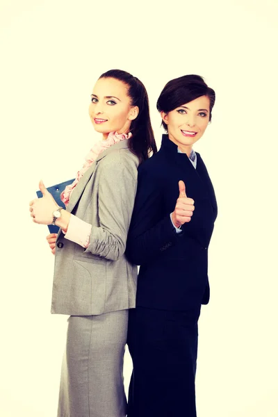 Smiling businesswomen with thumbs up. — Stock Photo, Image