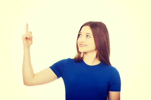 Young woman pointing up. — Stock Photo, Image