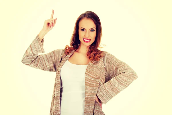 Feliz sorrindo mulher apontando para cima . — Fotografia de Stock