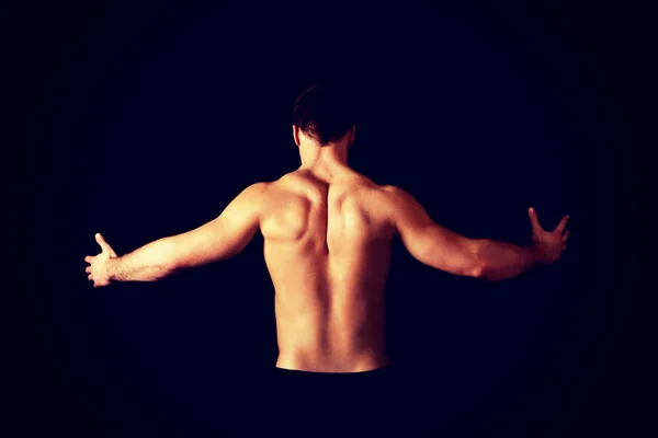 Sexy muscular man showing his muscular back. — Stock Photo, Image