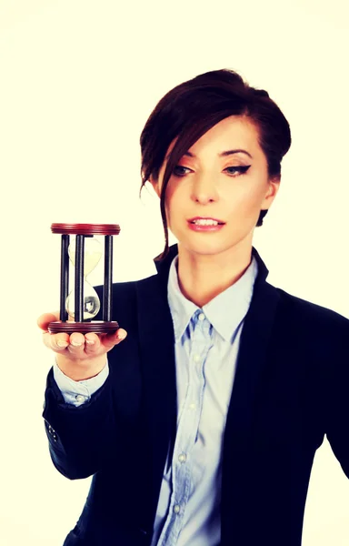 Businesswoman holding hourglass. — Stock Photo, Image