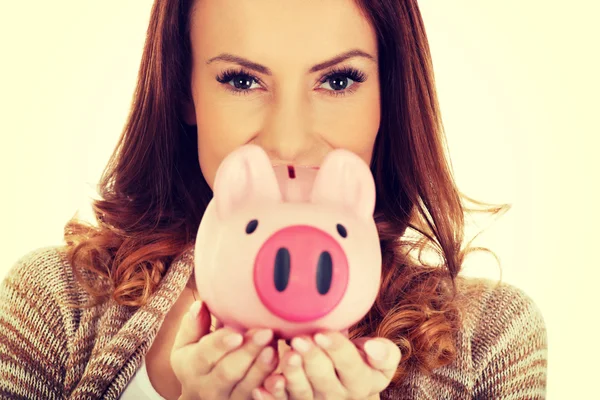 Piggy bank tartó alkalmi női. — Stock Fotó