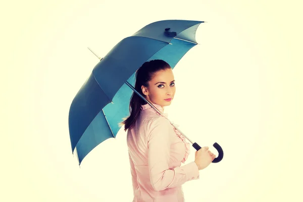 Business woman is holding blue umbrella. — Stock Photo, Image