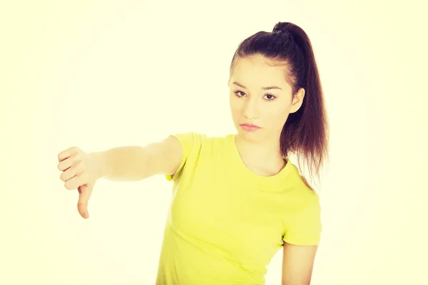 Mujer infeliz con los pulgares abajo . — Foto de Stock