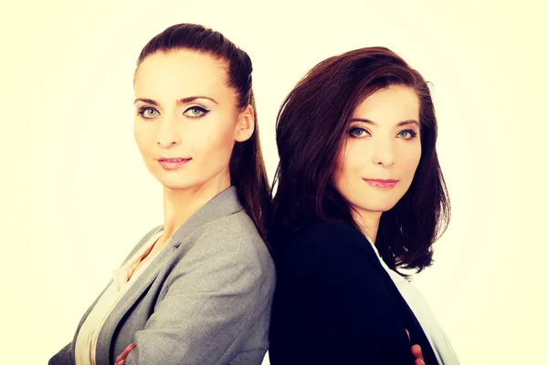 Due donne d'affari appoggiate l'una all'altra . — Foto Stock
