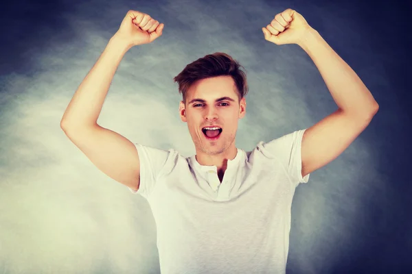 Young man showing winner gesture. — Stock Photo, Image