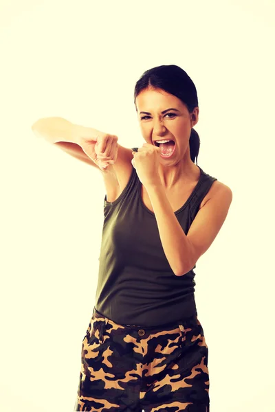 Woman in military clothes boxing to the camera — Stock Photo, Image