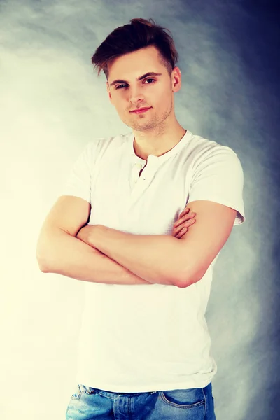 Young confident man with crossed arms. — Stock Photo, Image