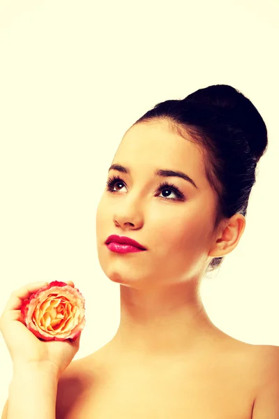 Beautiful woman with pink rose. — Stock Photo, Image