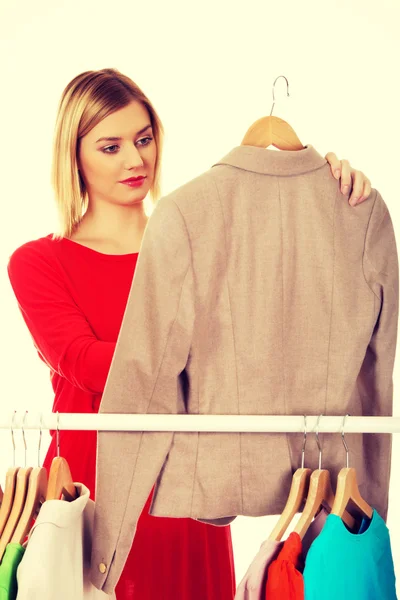 Woman deciding what to put on. — Stock Photo, Image