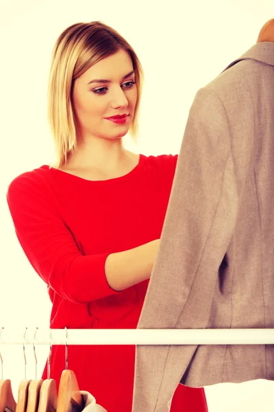 Woman deciding what to put on. — Stock Photo, Image