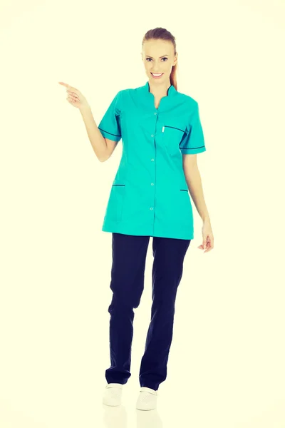 Female doctor pointing up. — Stock Photo, Image