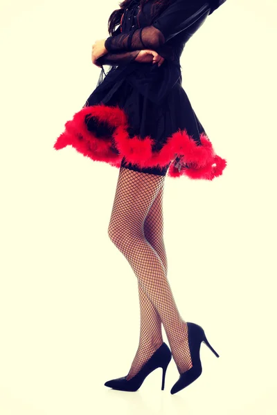 Woman legs wearing devil clothes — Stock Photo, Image