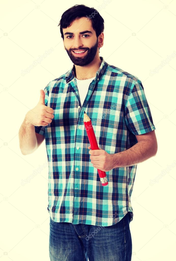 Young man holding big red pencil. ⬇ Stock Photo, Image by © piotr_marcinski  #96454768