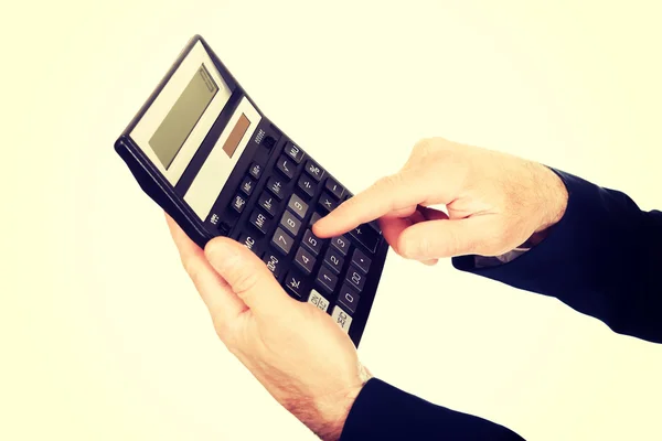 Male finger pushing the button on calculator — Stock Photo, Image