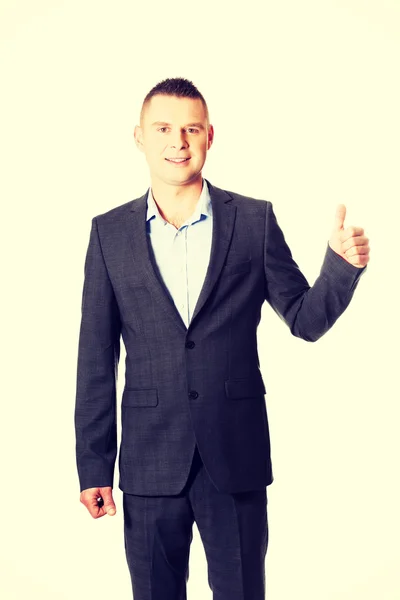 Young businessman gesturing ok sign — Stock Photo, Image