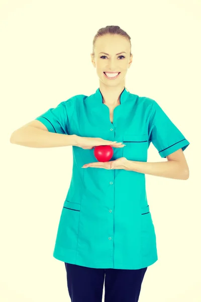 Female doctor with heart. — Stock Photo, Image