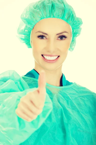 Médico cirujano mujer con pulgares arriba . —  Fotos de Stock