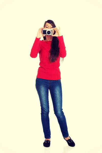 Woman taking a photo with a camera. — Stock Photo, Image