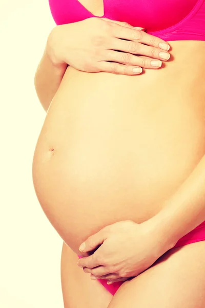 Mulher grávida tocando barriga — Fotografia de Stock