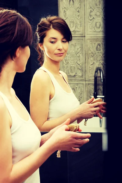 Woman cleaning her nails. — Stock Photo, Image