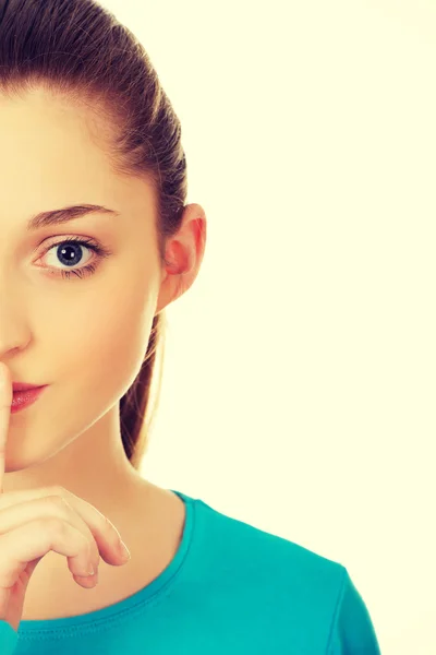 Teen woman with hush gesture. — Stock Photo, Image