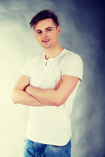 Young confident man with crossed arms. — Stock Photo, Image