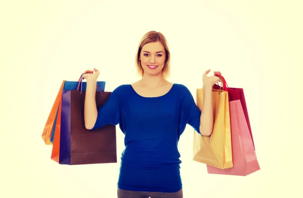 Femme avec beaucoup de sacs à provisions. — Photo