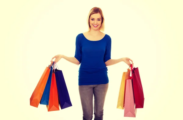 Mulher com um monte de sacos de compras. — Fotografia de Stock