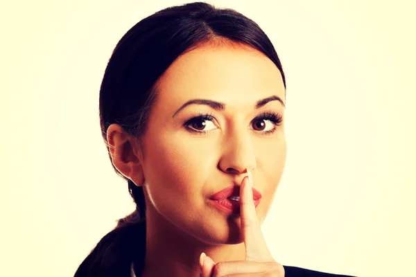 Businesswoman making silent sign — Stock Photo, Image