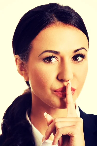 Businesswoman making silent sign — Stock Photo, Image