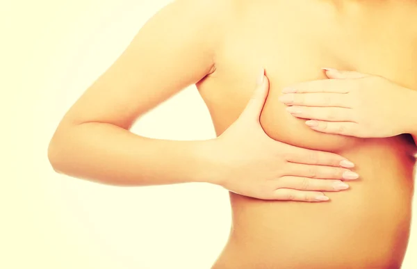 Woman examining breast. — Stock Photo, Image