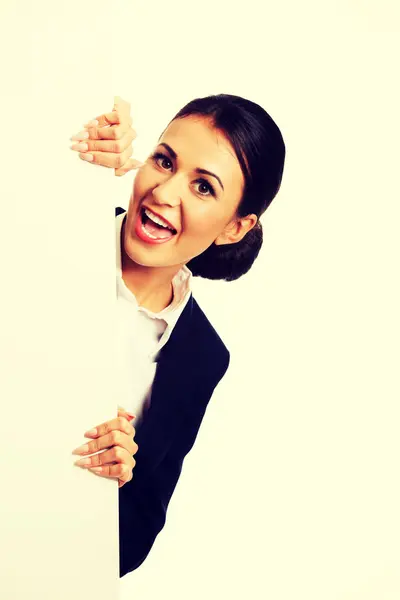 Businesswoman holding white banner — Stock Photo, Image