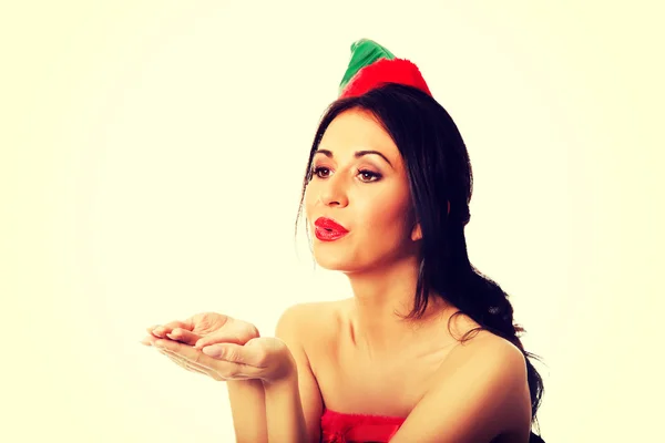 Mujer usando elfo ropa soplando beso — Foto de Stock