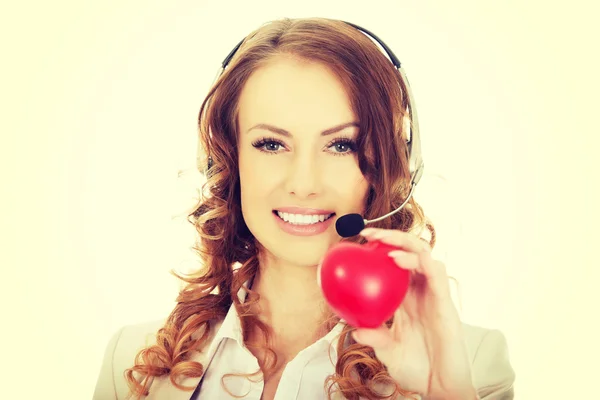 Call center donna con cuore giocattolo . — Foto Stock