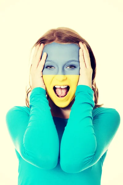 Woman with Ukraine flag on face. — Stock Photo, Image