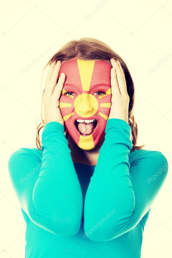 Woman with Macedonia flag on face. — Stock Photo © piotr_marcinski 96570124