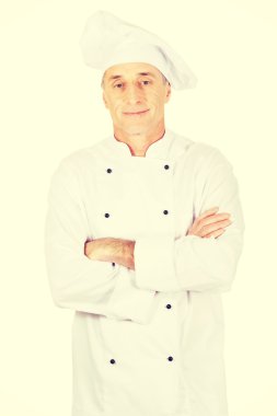 Erkek Şef katlanmış silah ile ayakta