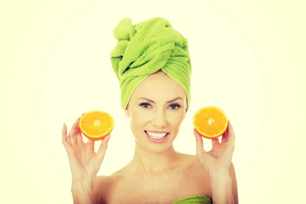 Beautiful woman with orange. — Stock Photo, Image