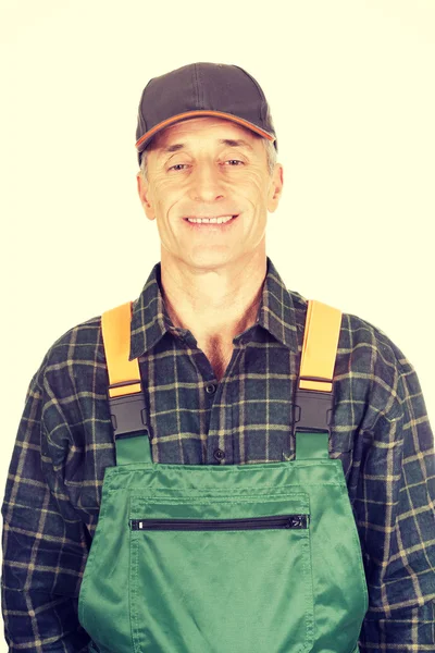 Volwassen tuinman permanent in uniform — Stockfoto