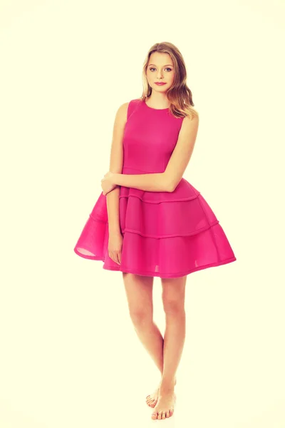 Young blonde woman with pink skirt — Stock Photo, Image