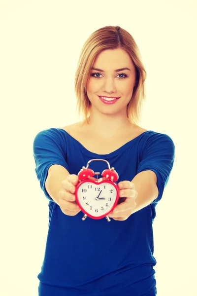 Woman with a clock. — Stock Photo, Image