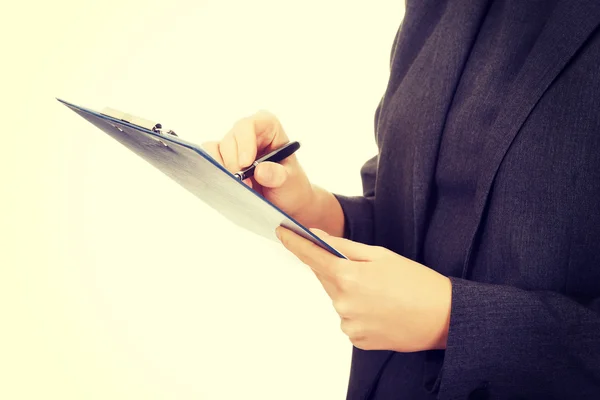 Business woman writing a note. — Stock Photo, Image