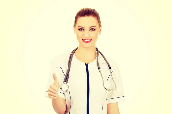 Médico mujer mostrando pulgares hacia arriba . —  Fotos de Stock