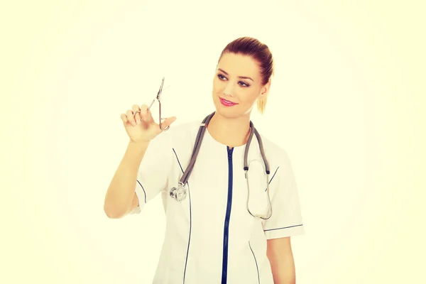 Doctor woman holding scissors. — Stock Photo, Image