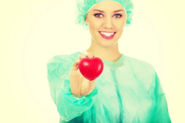 Doctor woman holding heart. — Stock Photo, Image