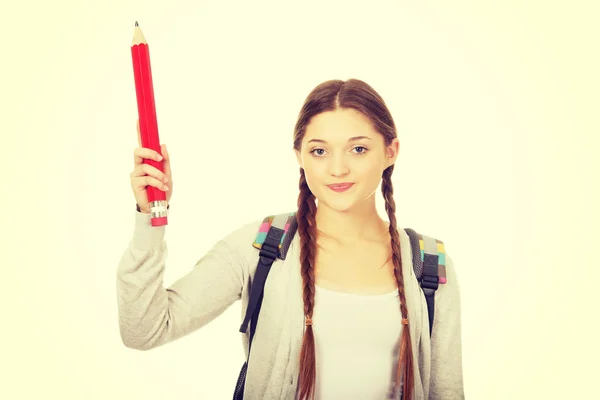 Estudante apontando para cima com lápis . — Fotografia de Stock