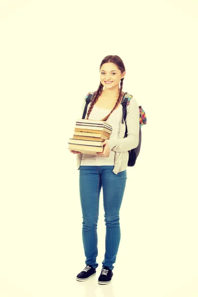 Mooie tiener met rugzak en boeken. — Stockfoto