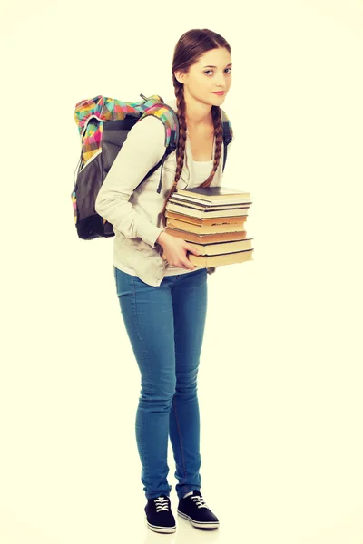 Vacker tonåring med ryggsäck och böcker. — Stockfoto